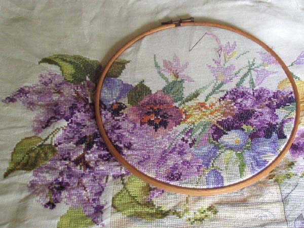 Close-up of an embroidery hoop ring showing the inner and outer rings with fabric stretched between them