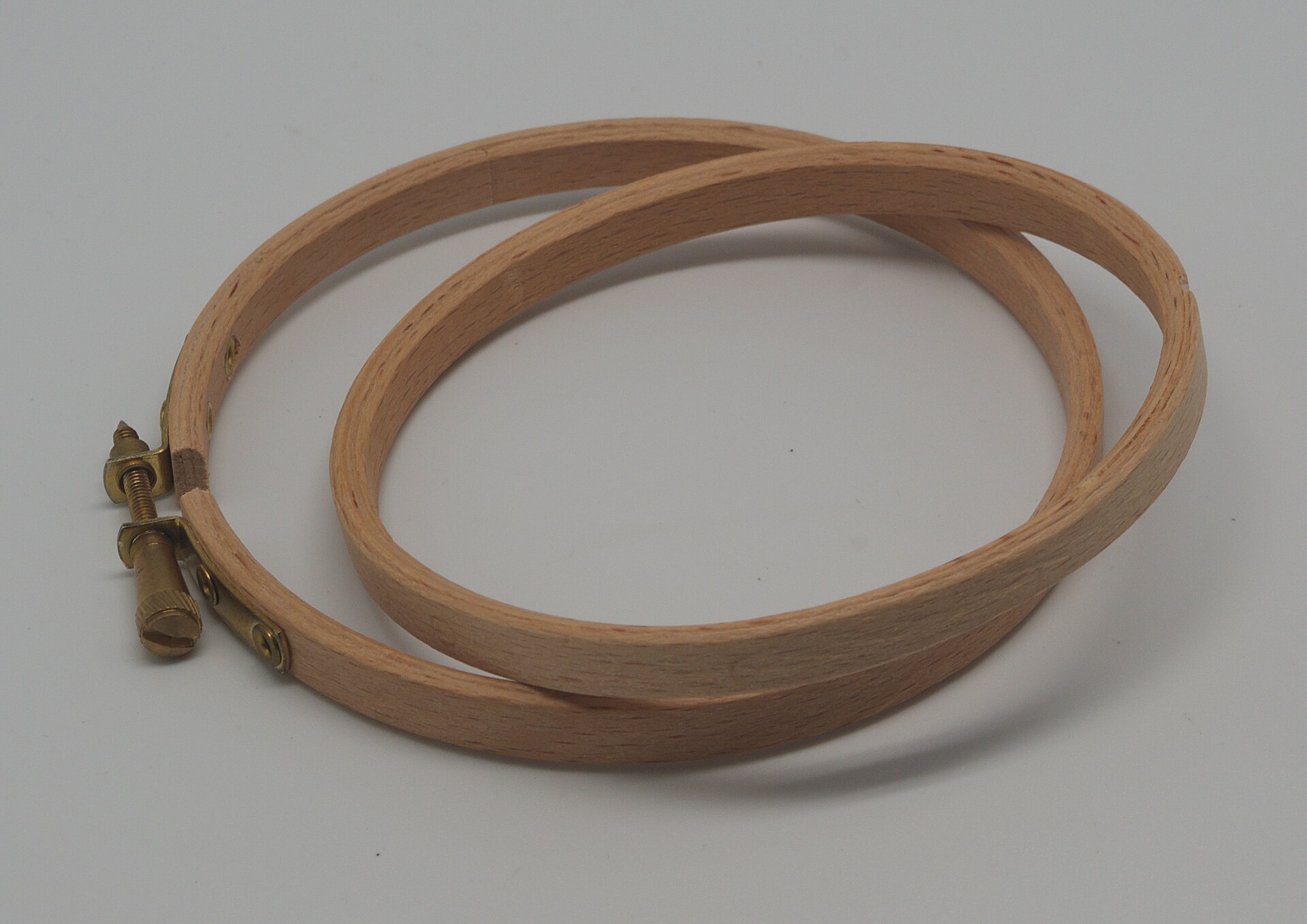 Wooden embroidery hoops, the round frames that hold fabric and stabilizer taut during stitching