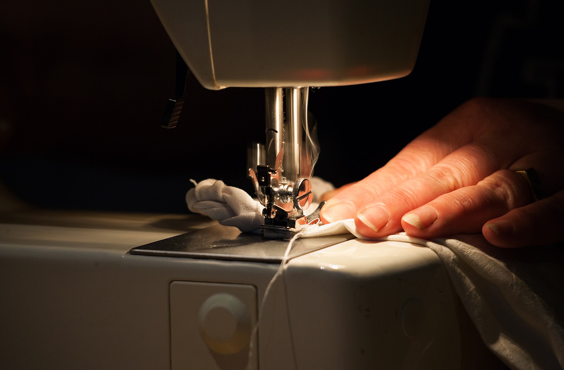 A beginner working at a home embroidery machine