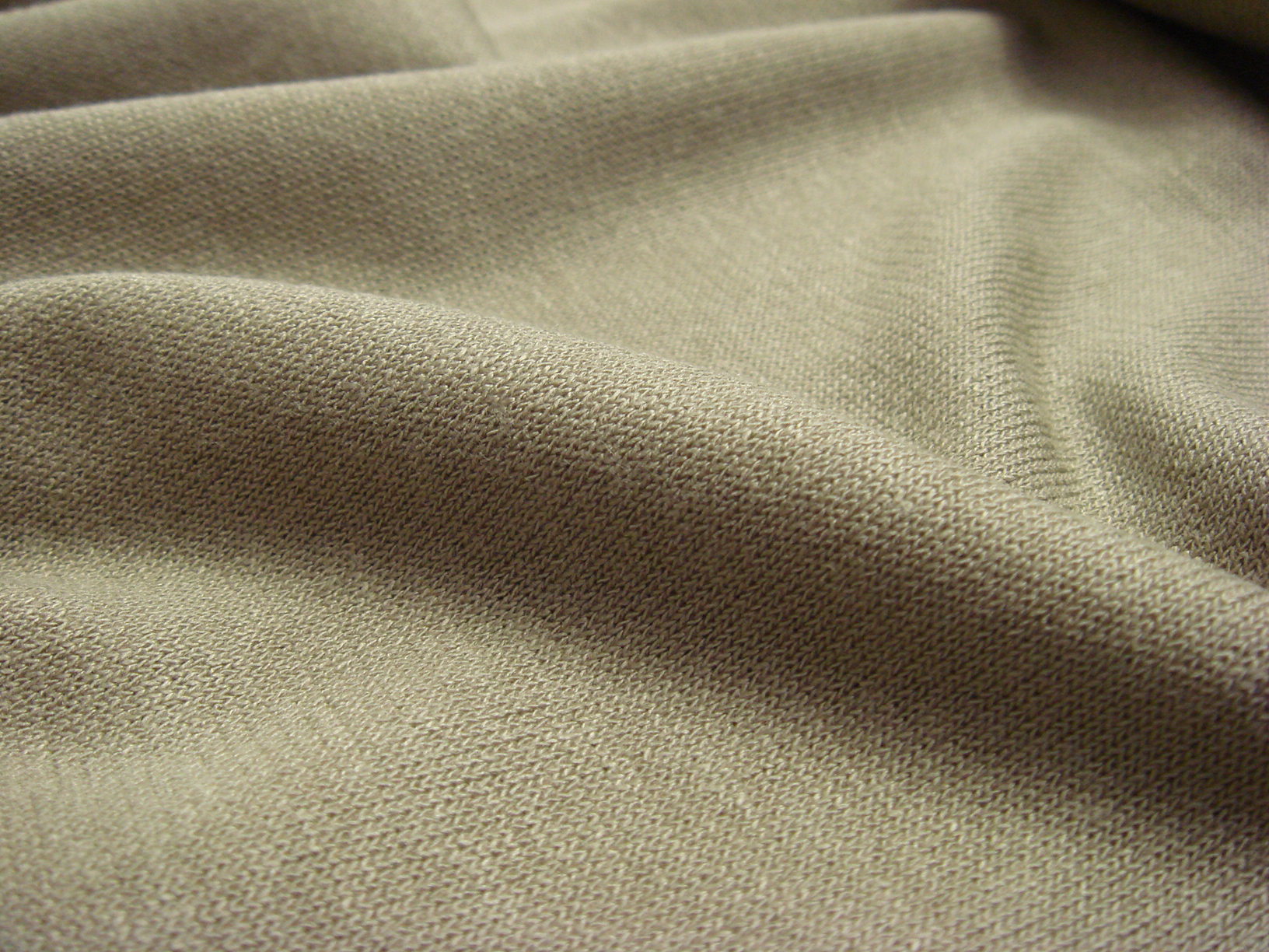 A serged, overlocked edge on stretchy knit fabric