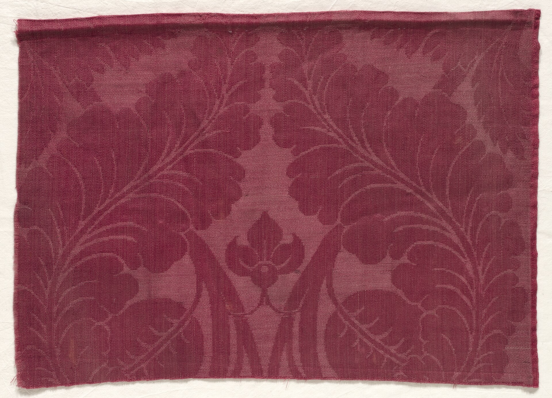 A detailed floral machine-embroidery design on fabric