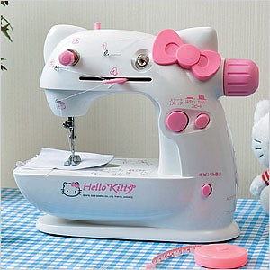A clean sewing and embroidery workspace with a machine, thread, and fabric organized on a table