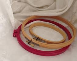Assorted embroidery hoops and frames in multiple sizes displayed on a surface