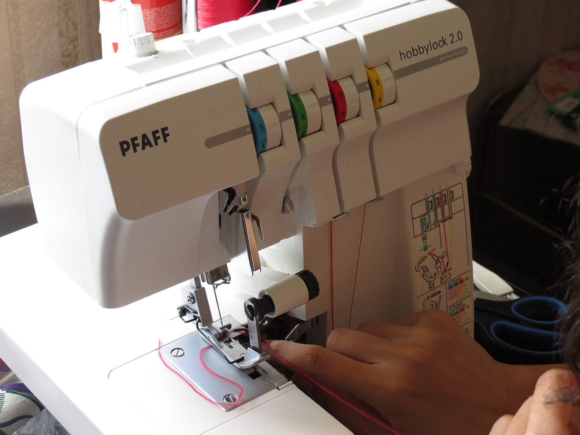 A Juki-class overlocker threaded and ready to sew